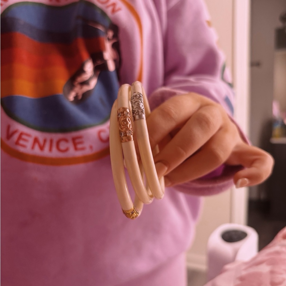 Elegant Buddha girl Cream Bangles with Gold and Silver Accents